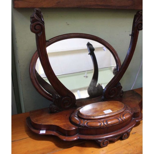 241 - A Victorian mahogany dressing table mirror, the serpentine base with lidded compartment, the base 67... 