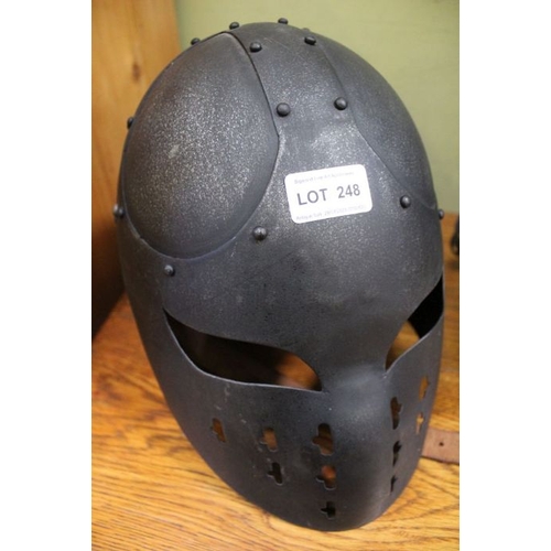 248 - An enclosed full face iron helmet.