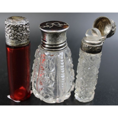 25 - A Victorian ruby glass scent bottle, with silver top, Birmingham 1891, together with a cut glass sce... 