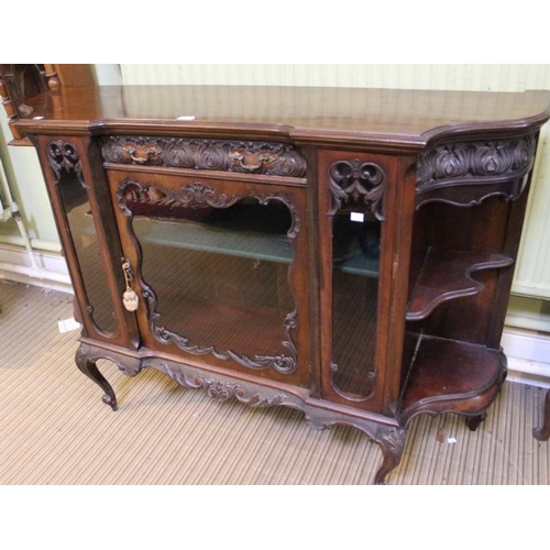 282 - A late 19th early 20th century, fancy shaped and glazed sideboard, with carved front central drawer ... 