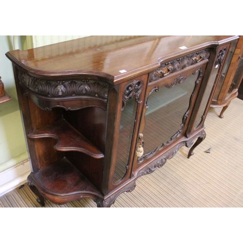 282 - A late 19th early 20th century, fancy shaped and glazed sideboard, with carved front central drawer ... 