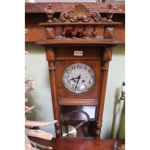 287 - An early 20th Century Mahogany Viennese style hanging wall clock with pendulum and key, 90cm