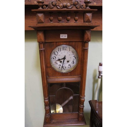 287 - An early 20th Century Mahogany Viennese style hanging wall clock with pendulum and key, 90cm