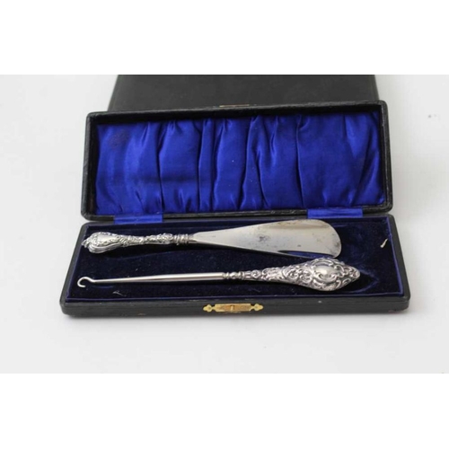 29 - A collection of silver items, containing; a tankard, mustard, cigarette case, case with shoe horn & ... 