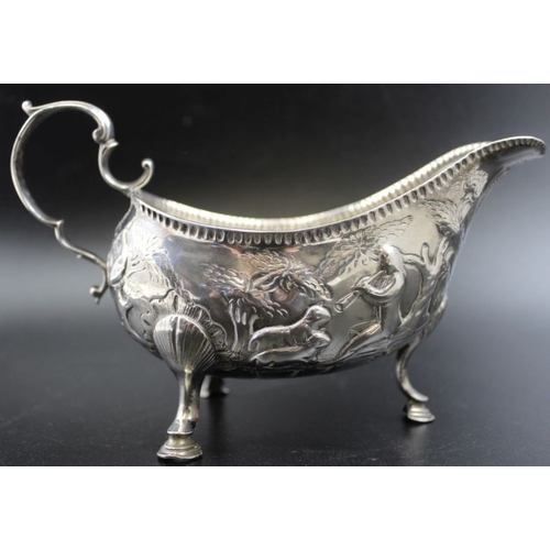 3 - Matthew West, an 18th century Irish sauce boat, with embossed farmyard scenes, hallmark worn, weight... 