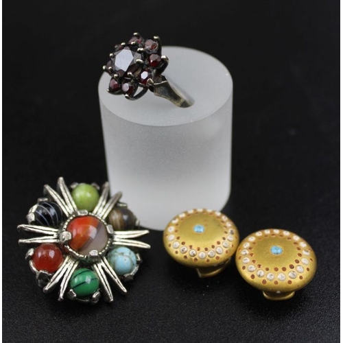 35 - A collection of costume jewellery, includes a garnet set ring, hardstone set bangle, etc.