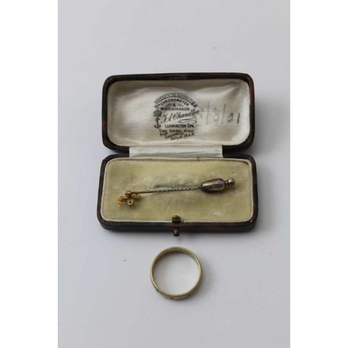 45 - A 15K stone set stick pin, in Chandler of Leamington Spa box, together with a diamond set band, size... 