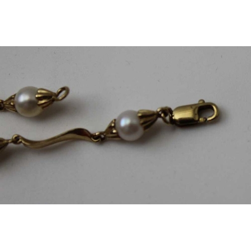 54 - A 9ct gold bracelet set cultured pearls, together with a pair of earrings, and a yellow metal bracel... 