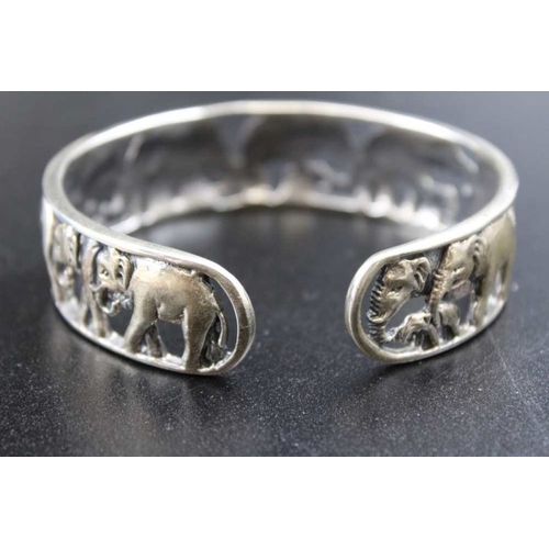 55 - A 20th century silver bangle, with pierced and cast elephant decoration, 4.8g