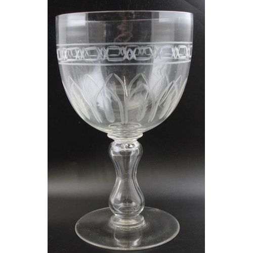 72 - A large Victorian blown glass goblet, the bowl with wheelcut decoration, hollow baluster stem on a c... 