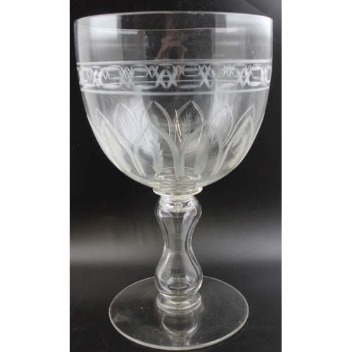 72 - A large Victorian blown glass goblet, the bowl with wheelcut decoration, hollow baluster stem on a c... 