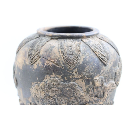 73 - A Japanese earthenware vase moulded with Samurai in a landscape, in the round  c.1900, incised marks... 