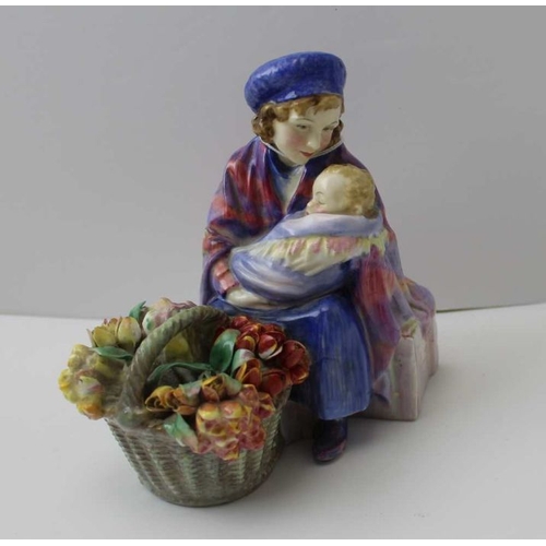 78 - An early Royal Doulton figure group of a female flower seller holding her baby with a basket of flow... 