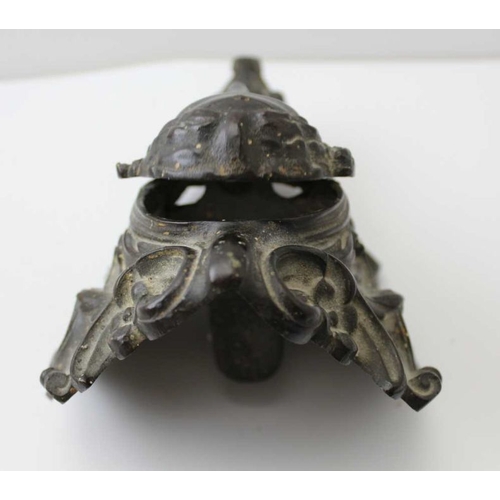 81 - A late 19th century bronze mount with articulated mask, 22cm high