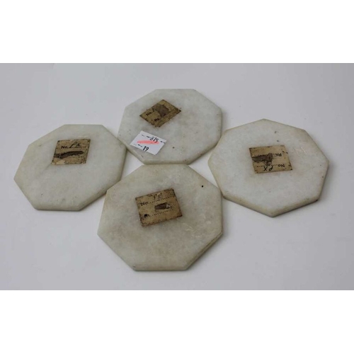 84 - A set of four octagonal, Indian marble coasters, inlaid floral designs, using various stones, includ... 