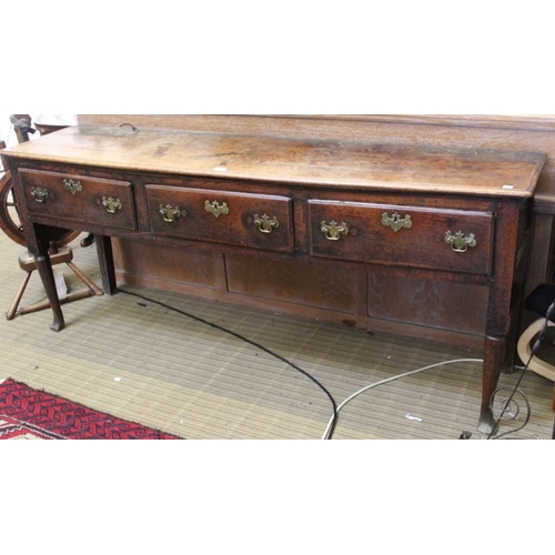 195 - A late 18th century oak three drawer plain dresser, having turned fore legs, plain rear, 76cm x 188c... 