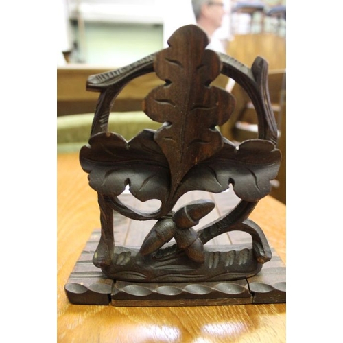 114 - A Black Forest carved wood extending book stand