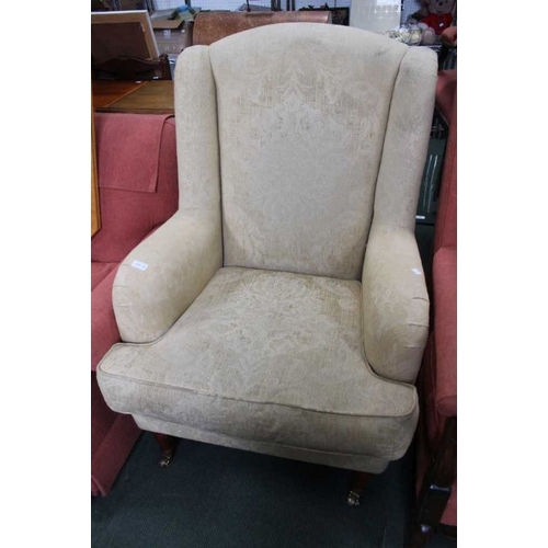 122 - An old gold chenille armchair.