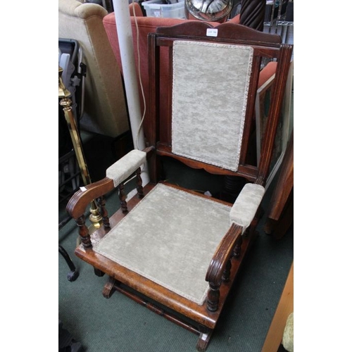 156 - A stained wood framed rocking chair, upholstered seat and back.