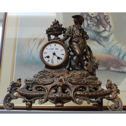 195 - A 19th century patinated cast metal mantel clock, decorated with a gardener, having bell strike, wit... 