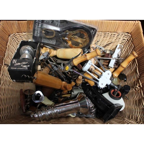 209 - A basket of corkscrews etc