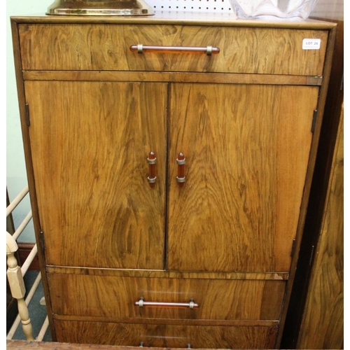 24 - A bedroom suite c.1930, comprising wardrobe, tall boy and dressing table with mirror back