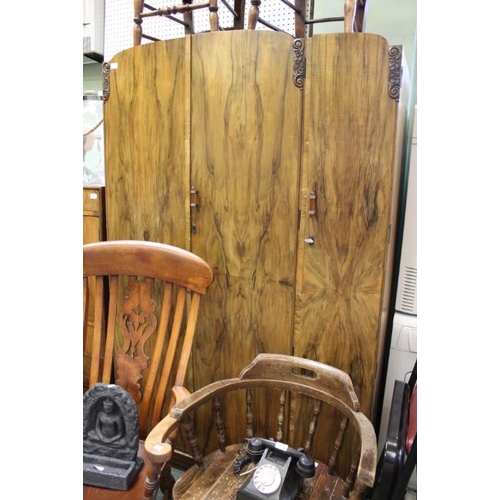 24 - A bedroom suite c.1930, comprising wardrobe, tall boy and dressing table with mirror back