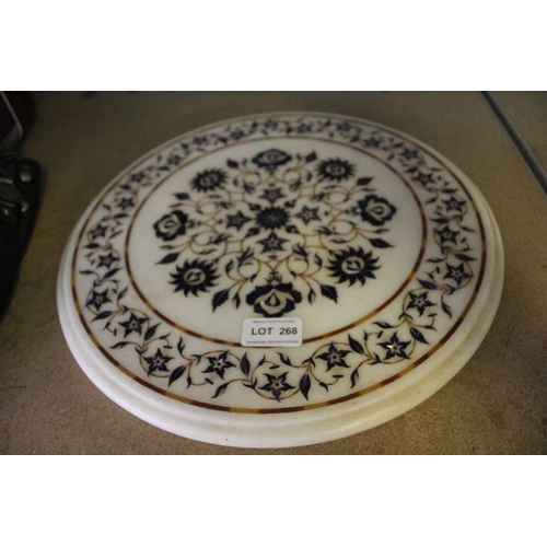 268 - An Indian inlaid marble table top, the flowers with mother-of-pearl highlights, 35cm dia