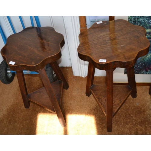 290 - A pair of two-tier oak tables with petal tops on three legs, 45cm in diameter