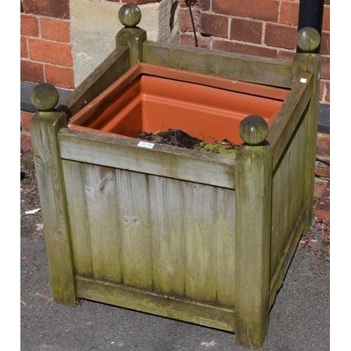 301 - A square formed wooden planter with plastic liner, 58cm square