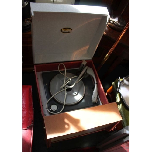 39 - An original mid-century two tone Dansett floor standing record player, supported on four tapering le... 