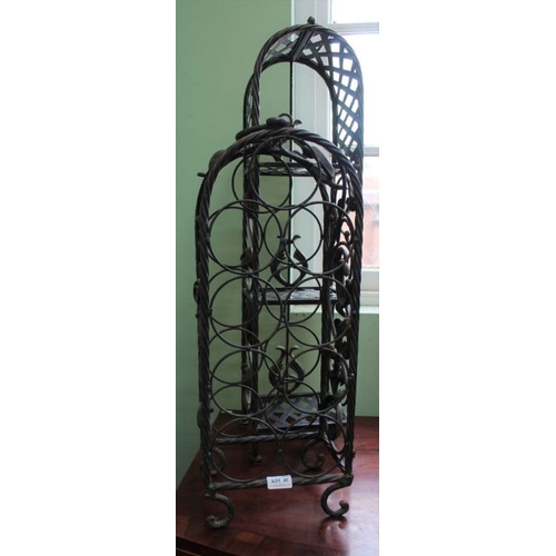 45 - A cast metal nine bottle wine rack with a metal slender set of shelves