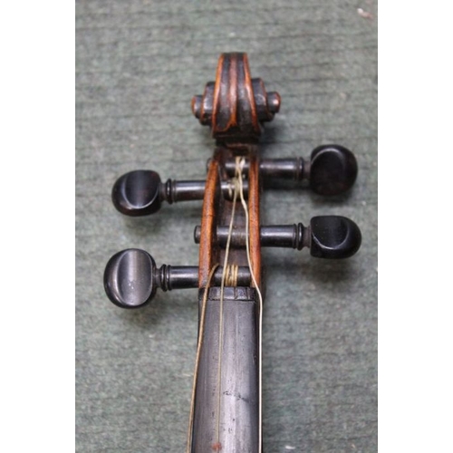 70 - An unnamed antique violin having one piece back with a mid 20th century unnamed bow i the remains of... 