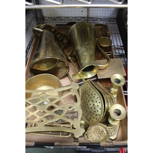 76 - A box containing a selection of brass wares includes a set of postal scales