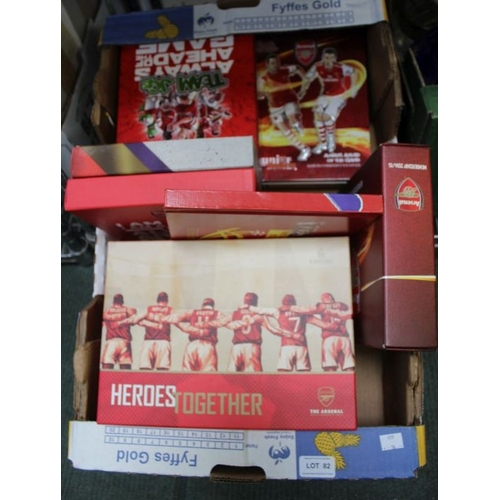 82 - A box of Arsenal football club memorabilia and a China world cup souvenir booklet containing coins a... 