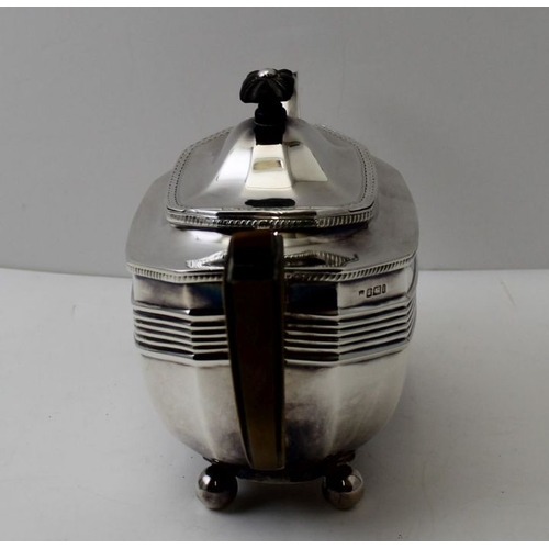1 - Thomas Bradbury and Sons, a Georgian design silver tea pot, raised on four ball feet, Sheffield 1901... 