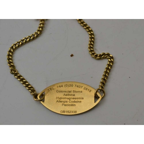 102 - A 9ct gold medic alert pendant, a 9ct gold medic alert wrist pendant on yellow metal chain, one othe... 