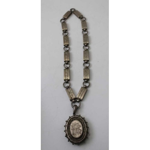 113 - A Victorian silver locket on chain, a silver buckle form bangle, a cameo, and other items of jewelle... 