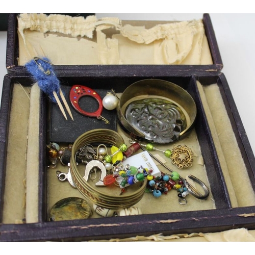 121 - A large quantity of costume jewellery, to include watches, a green leather jewellery case, etc.