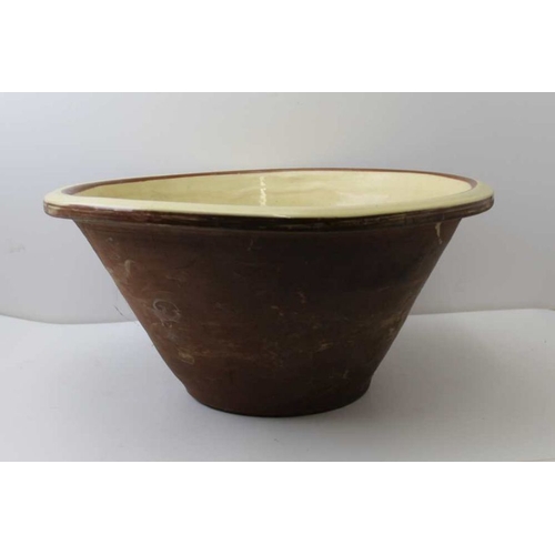 145 - A large vintage terracotta glazed dairy bowl, 48 cm diameter