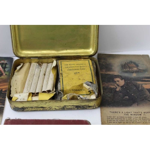 157 - WWI lot - includes Princess Mary tin with tobacco original contents, an infantry training 1914 book,... 