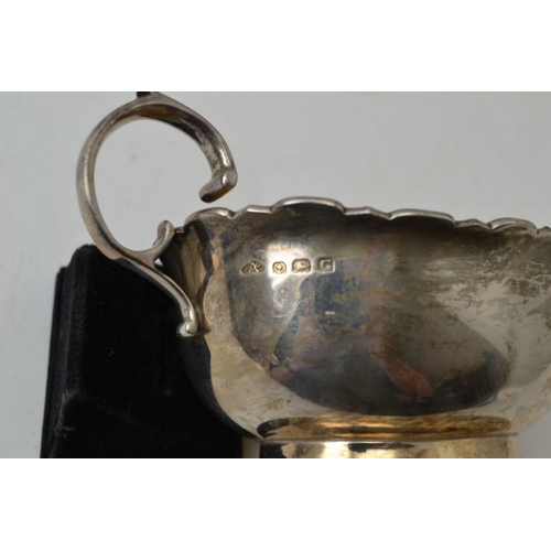17 - Adie Brothers, a pair of Georgian design silver sauceboats, having fancy rim and 