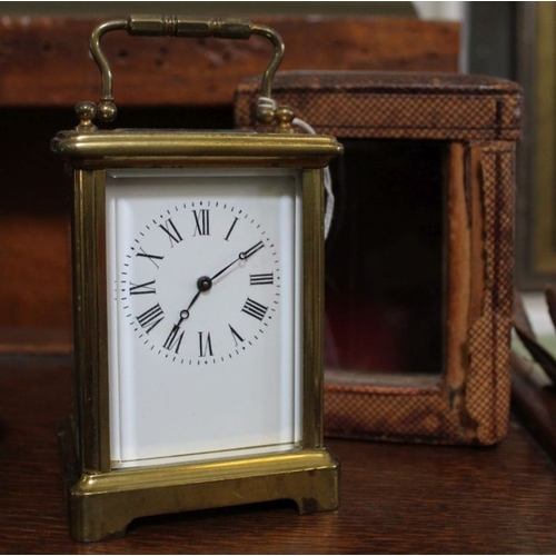 203 - A late 19th century French brass framed carriage clock, the white enamel dial, with Roman numerals, ... 