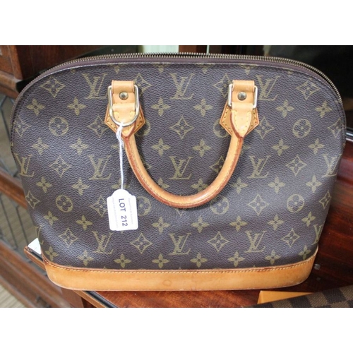 212 - A Louis Vuitton bag with shoulder strap and wallet