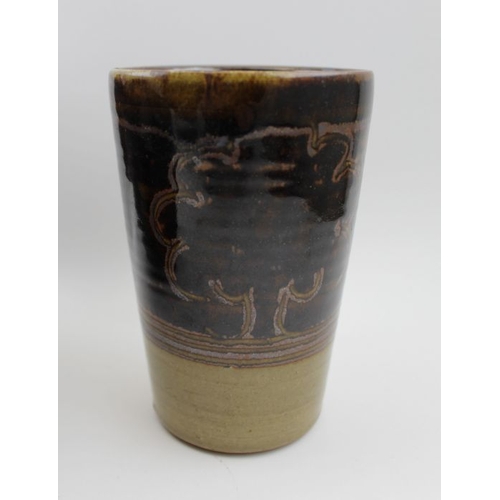 232 - A Winchcombe pottery stoneware vessel, with stylised tree decoration, together with a treacle glazed... 