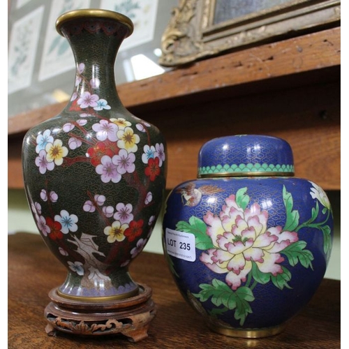 235 - A collection of Chinese cloisonné wares, includes a pair of black ground vases on wooden stands, a b... 