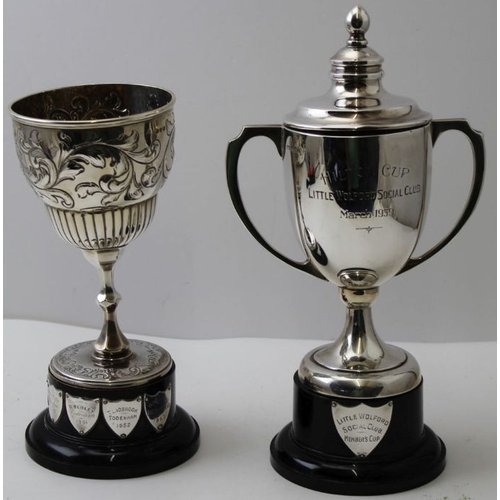 24 - Two silver presentation trophy cups, one a two handled Walker and Hall Sheffield 1938, on socle base... 