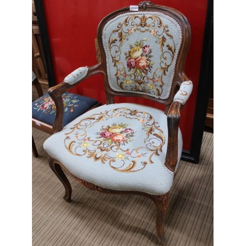 273 - A modern beech framed French design armchair with floral wool work pads 86 cm high