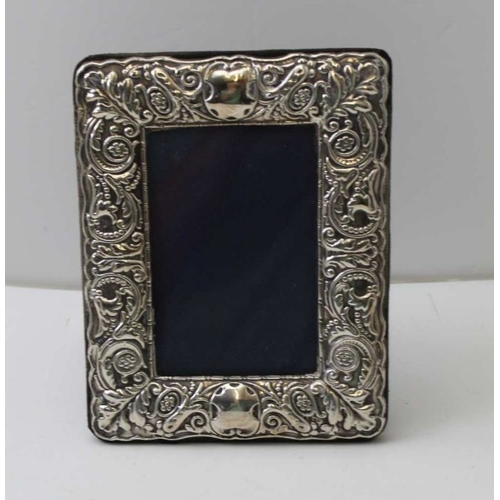 3 - A Victorian design embossed silver photograph frame, Birmingham 1991, to display and image 12cm x 8c... 