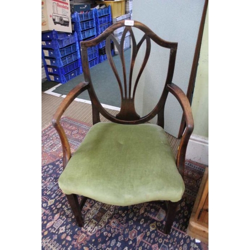 323 - A 19th century mahogany shield backed armchair with serpentine fronted overstuffed seat pad, 94cm